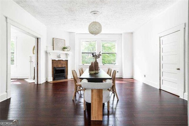 118 Waverly Way, Atlanta, GA 30307 - dining space with a textured ceiling, hardwood / wood-style flooring, and a fireplace with flush hearth