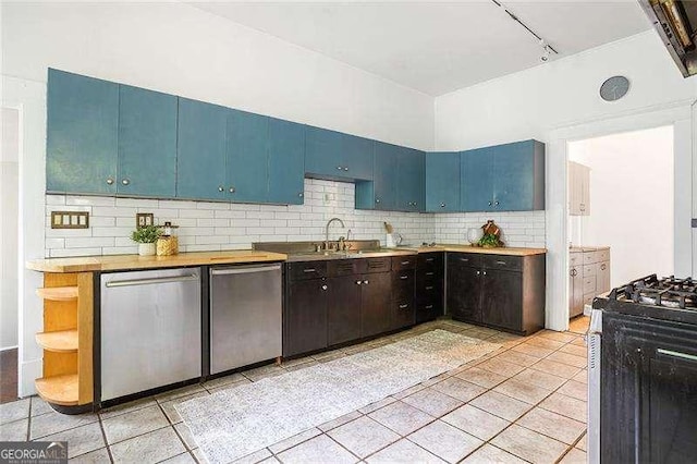 118 Waverly Way, Atlanta, GA 30307 - kitchen featuring stainless steel dishwasher, gas range oven, rail lighting, and light tile patterned flooring