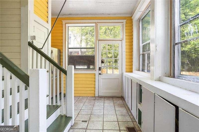 118 Waverly Way, Atlanta, GA 30307 - doorway with wooden walls, healthy amount of natural light, and stairs