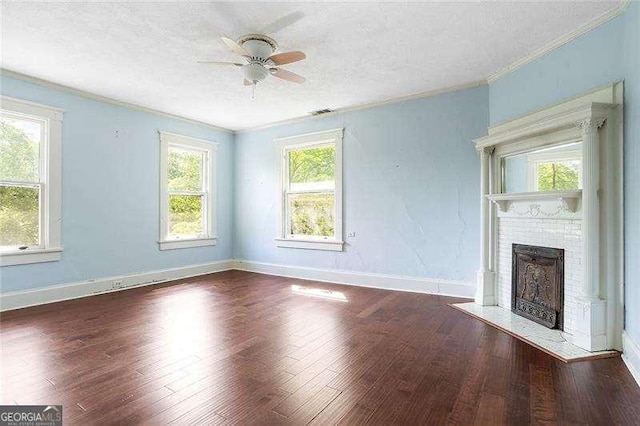 118 Waverly Way, Atlanta, GA 30307 - unfurnished living room with a ceiling fan, crown molding, a fireplace, a textured ceiling, and wood finished floors