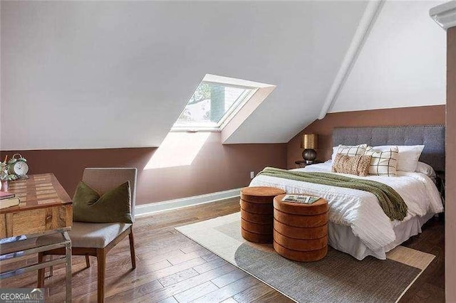 118 Waverly Way, Atlanta, GA 30307 - bedroom featuring vaulted ceiling, wood finished floors, a skylight, and baseboards