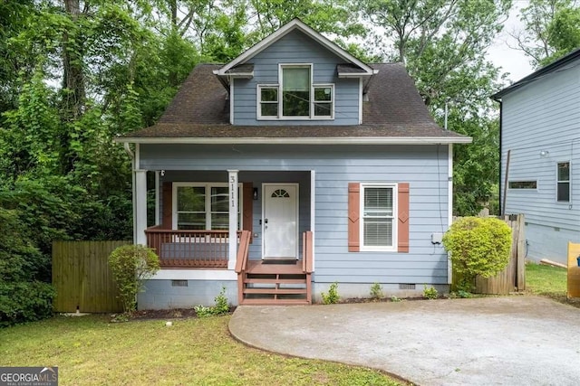 3111 Jones St, East Point, GA 30344 - bungalow-style house featuring crawl space, a porch, a shingled roof, and a front lawn