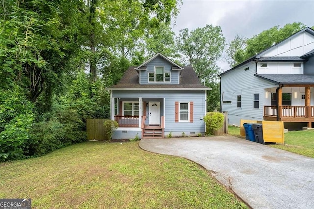 3111 Jones St, East Point, GA 30344 - bungalow-style home with covered porch, crawl space, a front yard, and driveway