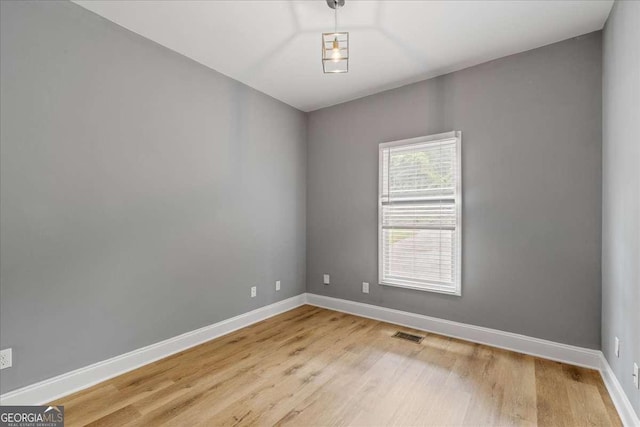 3111 Jones St, East Point, GA 30344 - empty room featuring light wood-type flooring and baseboards