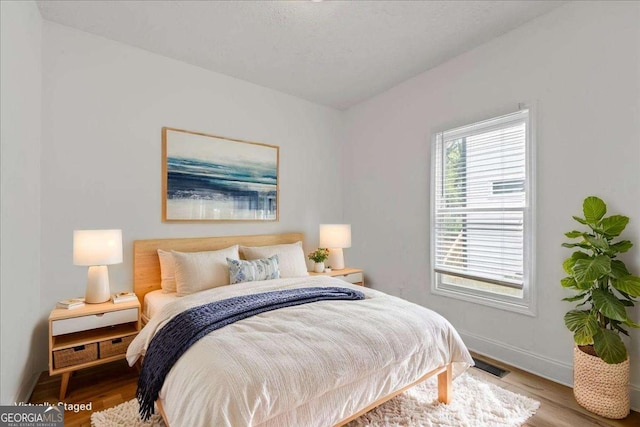 3111 Jones St, East Point, GA 30344 - bedroom featuring wood finished floors and baseboards