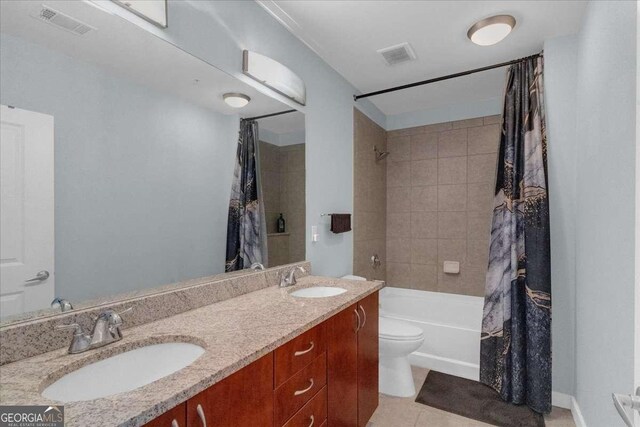 400 W Peachtree St NW Unit 2604, Atlanta, GA 30308 - bathroom featuring shower / bath combo, tile patterned floors, double vanity, and toilet
