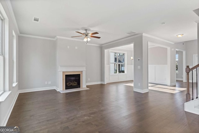1438 Sunny Valley Ln, Braselton, GA 30517 - unfurnished living room featuring ceiling fan, a glass covered fireplace, dark wood-style flooring, stairway, and baseboards