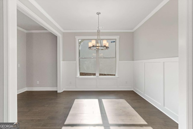 1438 Sunny Valley Ln, Braselton, GA 30517 - unfurnished dining area featuring a chandelier, dark wood-type flooring, a wainscoted wall, a decorative wall, and ornamental molding