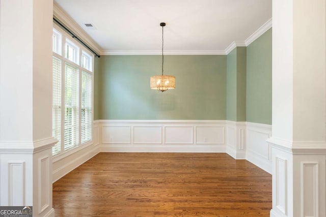 2165 Mcfarlin Ln, Alpharetta, GA 30004 - unfurnished dining area featuring ornamental molding, wood finished floors, a chandelier, and wainscoting