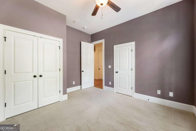 2165 Mcfarlin Ln, Alpharetta, GA 30004 - unfurnished bedroom with light colored carpet, baseboards, a closet, and ceiling fan