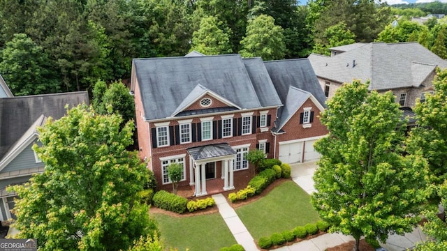 2165 Mcfarlin Ln, Alpharetta, GA 30004 - view of front of home with driveway, a garage, and a front yard