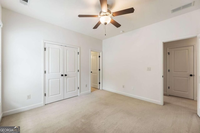 2165 Mcfarlin Ln, Alpharetta, GA 30004 - unfurnished bedroom featuring light carpet, baseboards, ceiling fan, and a closet