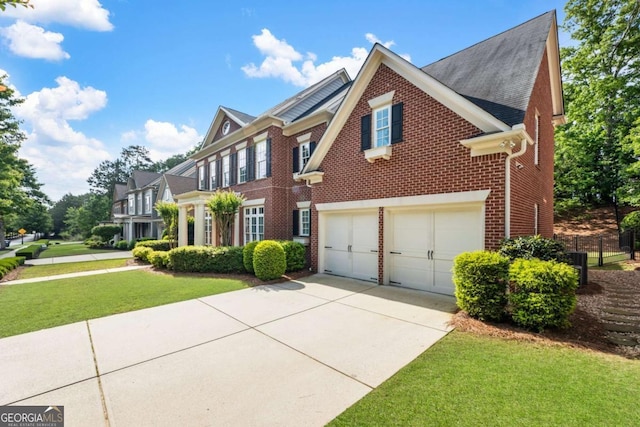 2165 Mcfarlin Ln, Alpharetta, GA 30004 - view of front of house featuring brick siding, a garage, concrete driveway, a front lawn, and a shingled roof