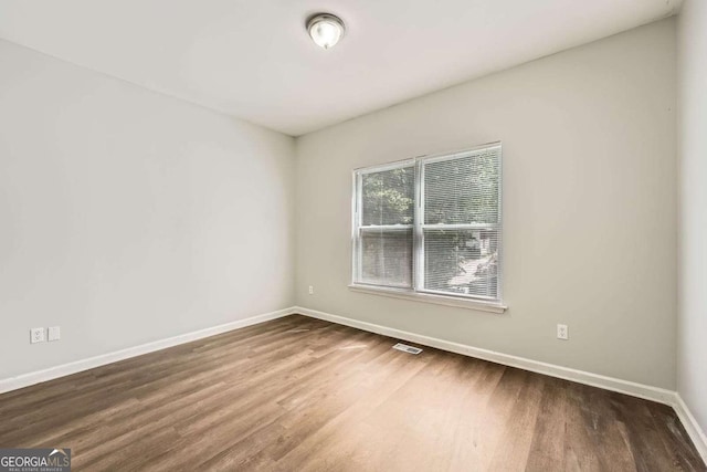 558 Elbridge Dr NW, Atlanta, GA 30318 - empty room with wood finished floors