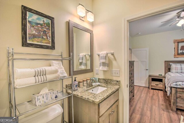 255 S Grove St, Dahlonega, GA 30533 - bathroom with wood finished floors, vanity, and ceiling fan