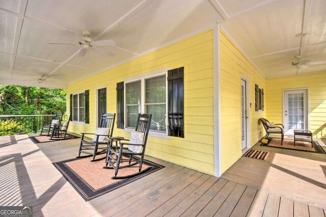 255 S Grove St, Dahlonega, GA 30533 - wooden deck with a ceiling fan and covered porch