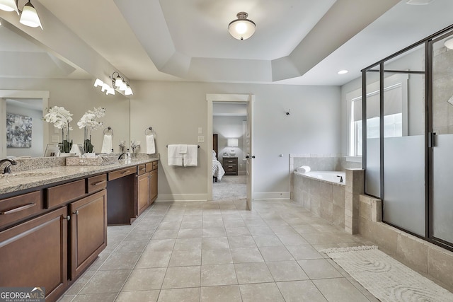 full bathroom with a garden tub, a raised ceiling, tile patterned floors, double vanity, and a shower stall