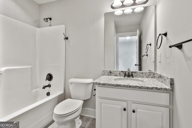 full bathroom featuring baseboards, toilet, vanity, shower / washtub combination, and tile patterned floors