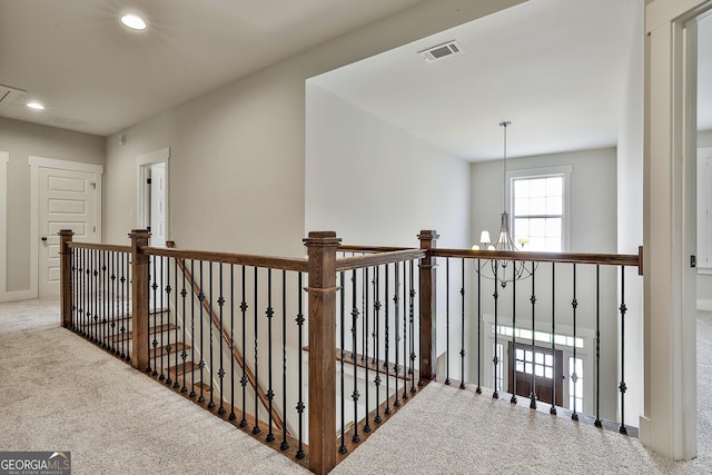 hallway with an upstairs landing, carpet flooring, recessed lighting, and baseboards