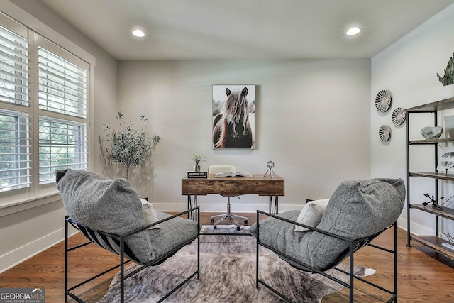 office space with baseboards, recessed lighting, and wood finished floors