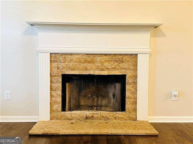 107 Oconnor Dr, Dallas, GA 30157 - detailed view of a tile fireplace, wood finished floors, and baseboards
