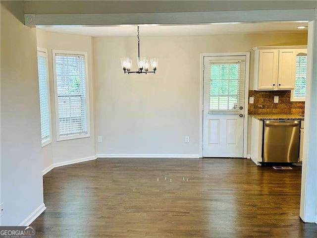 107 Oconnor Dr, Dallas, GA 30157 - unfurnished dining area featuring a chandelier, dark wood-type flooring, and baseboards