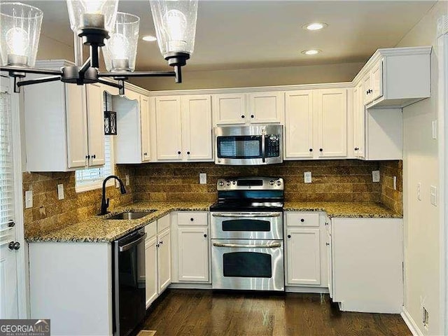 107 Oconnor Dr, Dallas, GA 30157 - kitchen with stainless steel appliances, a sink, stone countertops, white cabinets, and recessed lighting