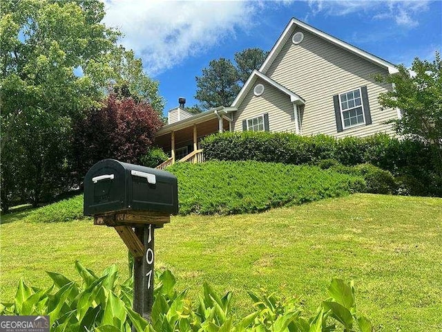 107 Oconnor Dr, Dallas, GA 30157 - view of front of home featuring a front yard and a chimney