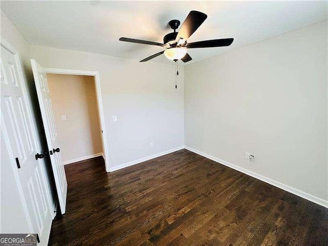 107 Oconnor Dr, Dallas, GA 30157 - spare room featuring a ceiling fan, dark wood finished floors, and baseboards