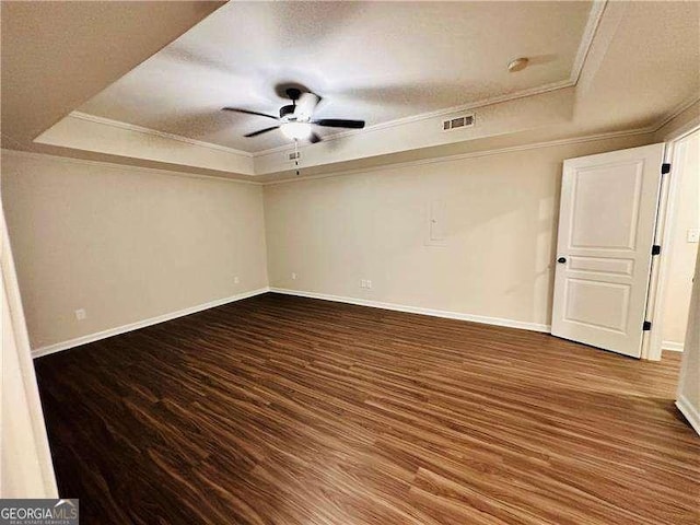 107 Oconnor Dr, Dallas, GA 30157 - spare room with a raised ceiling, wood finished floors, baseboards, ornamental molding, and ceiling fan