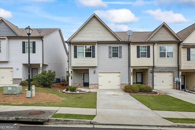 360 Turtle Creek Dr, Winder, GA 30680 - view of front of house with brick siding, driveway, an attached garage, central AC, and a front yard