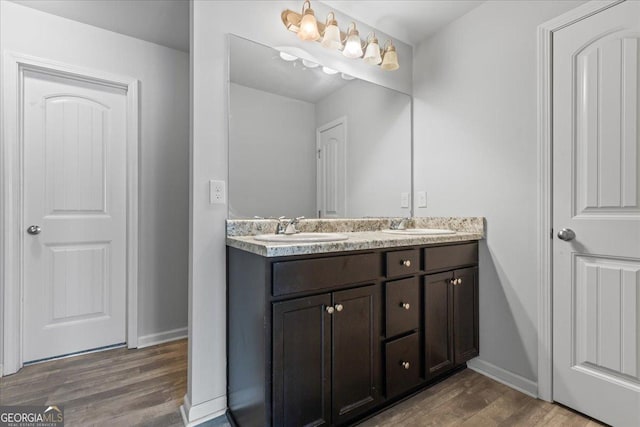 360 Turtle Creek Dr, Winder, GA 30680 - full bathroom with double vanity, wood finished floors, and baseboards