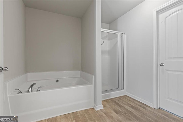 360 Turtle Creek Dr, Winder, GA 30680 - full bathroom featuring a bath, a shower stall, wood finished floors, and baseboards
