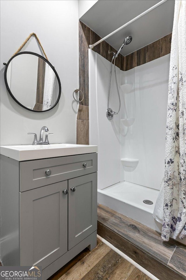 360 Turtle Creek Dr, Winder, GA 30680 - full bath featuring vanity, wood finished floors, and a shower with curtain