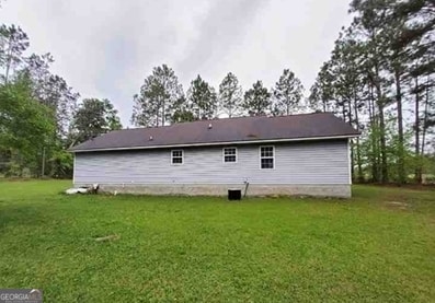 1818 Ga Highway 117, Rentz, GA 31075 - back of property featuring a yard