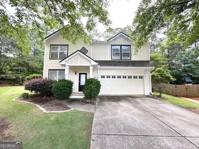 traditional-style home with a garage, concrete driveway, and a shingled roof