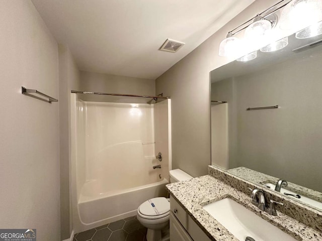 full bathroom featuring toilet, tile patterned flooring, vanity, and shower / bath combination