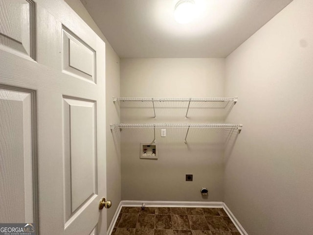 laundry room featuring washer hookup, electric dryer hookup, and baseboards