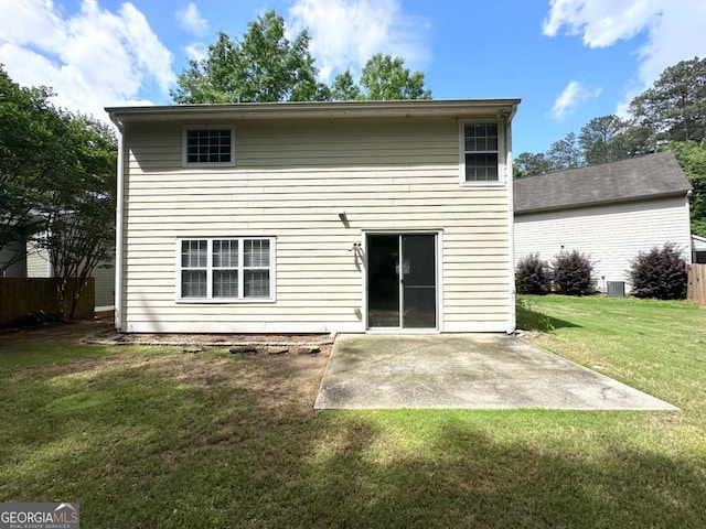 rear view of house with a patio and central AC unit