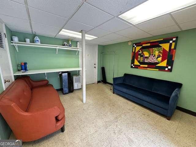 1233 Woodland Ave NE Unit 5, Atlanta, GA 30324 - living room with a drop ceiling and baseboards