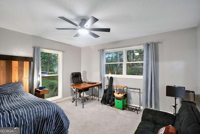109 Mackqueen Dr, Brunswick, GA 31525 - carpeted bedroom featuring a textured ceiling, baseboards, and a ceiling fan