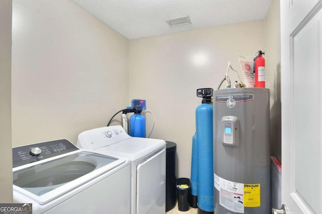109 Mackqueen Dr, Brunswick, GA 31525 - laundry room with electric water heater, independent washer and dryer, and a textured ceiling