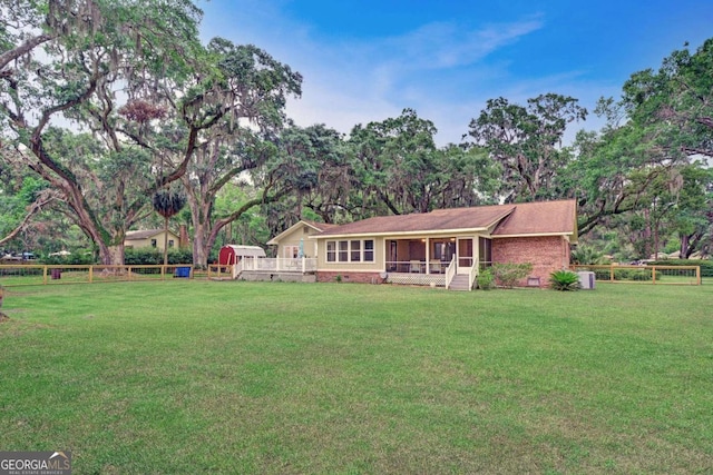 109 Mackqueen Dr, Brunswick, GA 31525 - rear view of property with a sunroom, crawl space, and brick siding