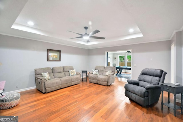 109 Mackqueen Dr, Brunswick, GA 31525 - living area with a tray ceiling, wood finished floors, a ceiling fan, recessed lighting, and crown molding