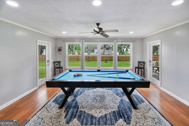 109 Mackqueen Dr, Brunswick, GA 31525 - game room featuring crown molding, healthy amount of natural light, wood finished floors, billiards table, and a textured ceiling
