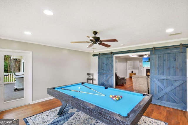 109 Mackqueen Dr, Brunswick, GA 31525 - playroom with a barn door, wood finished floors, billiards, ceiling fan, and ornamental molding