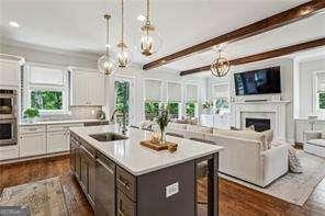 3617 Carson Ln SE, Smyrna, GA 30080 - kitchen with appliances with stainless steel finishes, plenty of natural light, a sink, beam ceiling, and recessed lighting