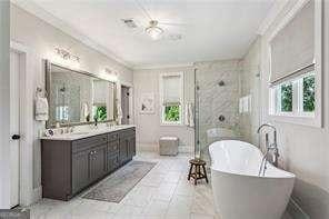 3617 Carson Ln SE, Smyrna, GA 30080 - full bath with a freestanding tub, double vanity, crown molding, and a stall shower