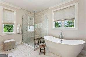 3617 Carson Ln SE, Smyrna, GA 30080 - full bath featuring healthy amount of natural light, a freestanding bath, a stall shower, and tile patterned flooring