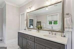 3617 Carson Ln SE, Smyrna, GA 30080 - bathroom featuring crown molding and double vanity